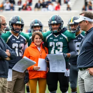 Coaching staff discussing player recruitment strategies for college football.